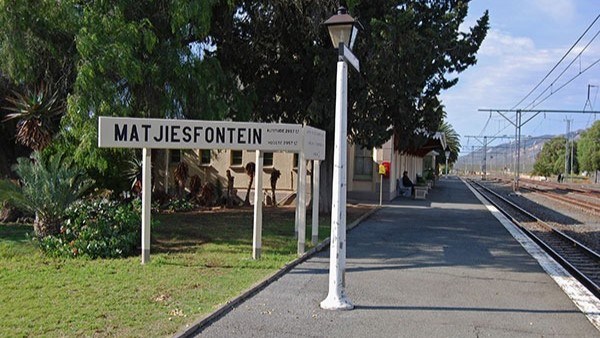 Matjiesfontein train station platform with sign and lamp post.